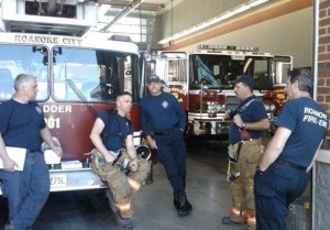 Station 1 guys hanging out after a call. He is seated on the front of reserve ladder 901. Photo from Station 1 Blog